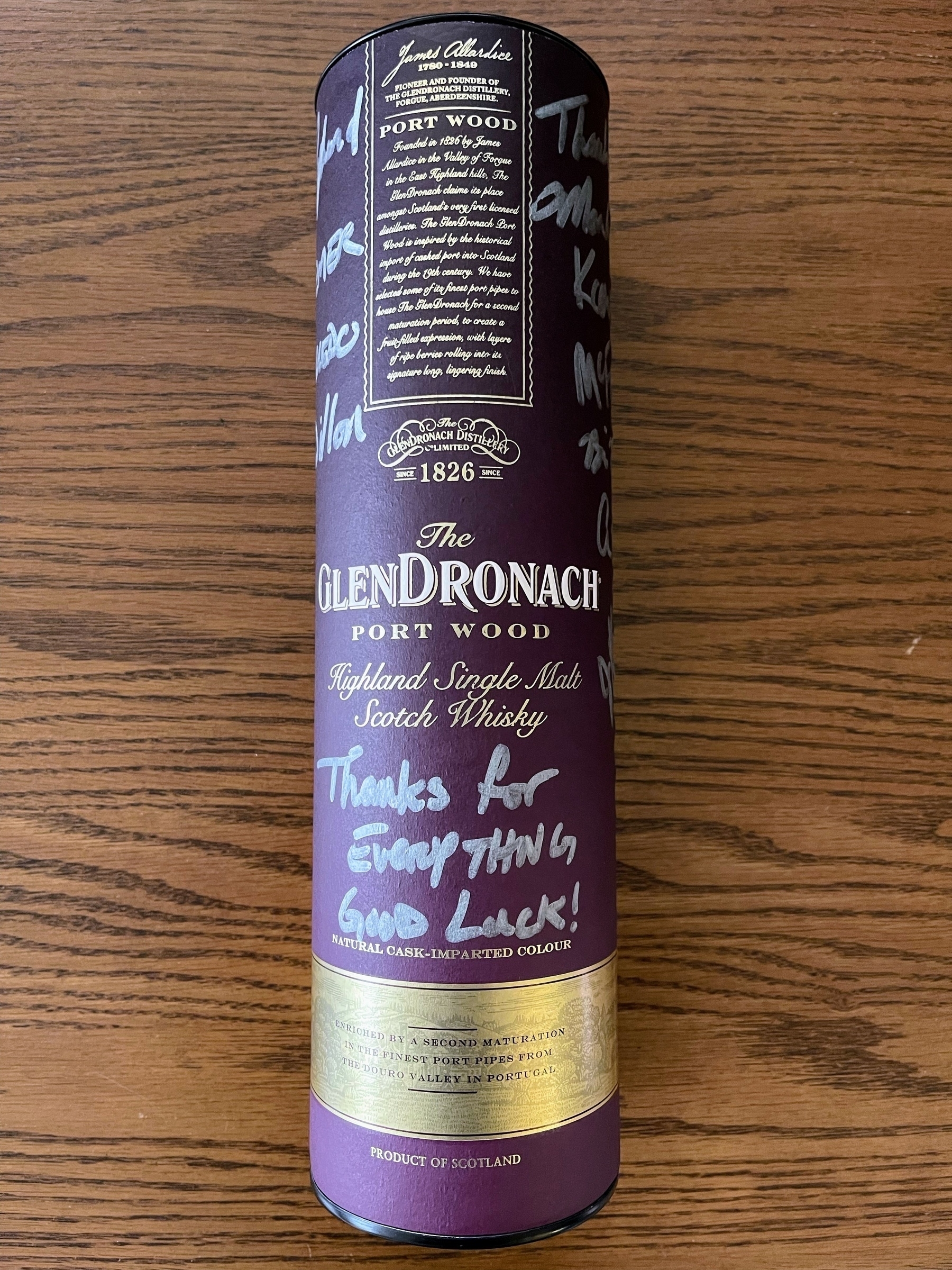 GlenDronach port wood bottle. “Thanks for everything. Good luck!” signed by 10 people in silver marker.