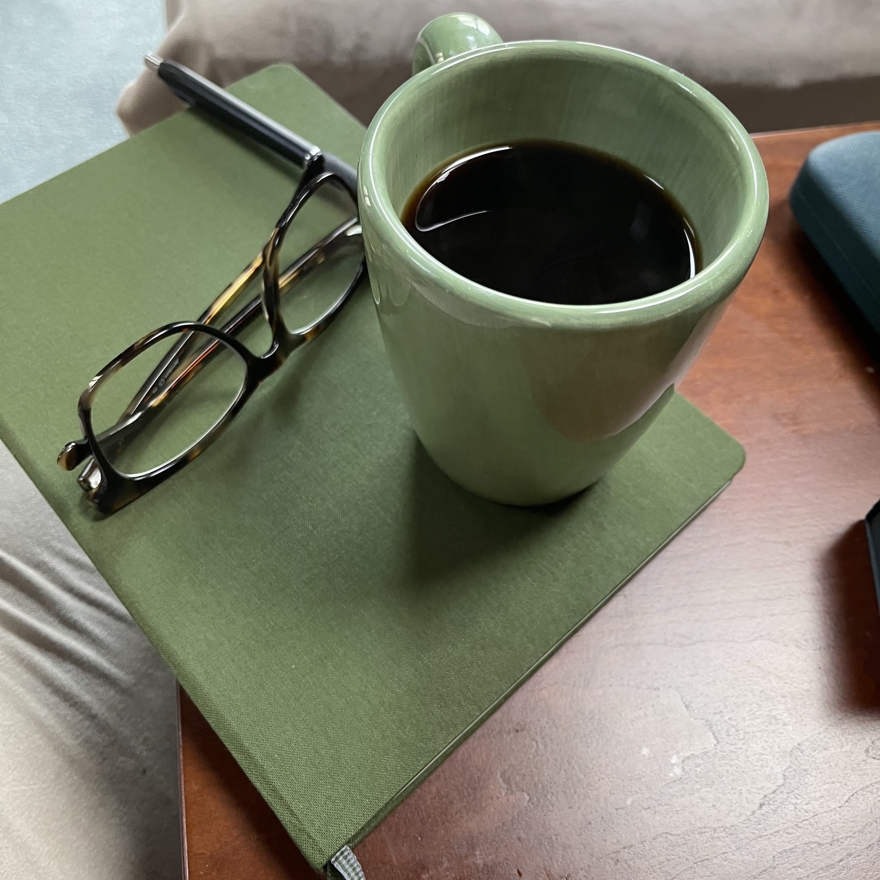 Glasses and coffee and notebook all matchy matchy 