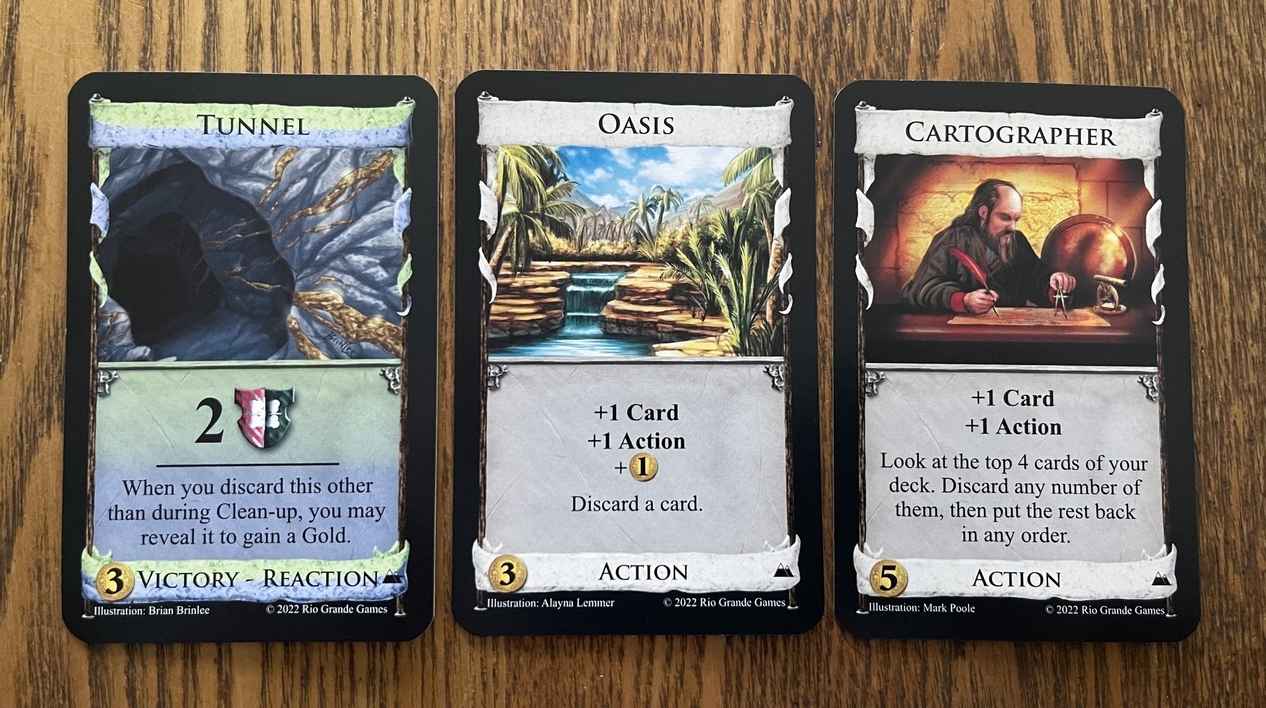 Dominion cards: tunnel, oasis, and cartographer. Two of them have a discard action included, and once gives you a gold when it’s discarded from a discard action.